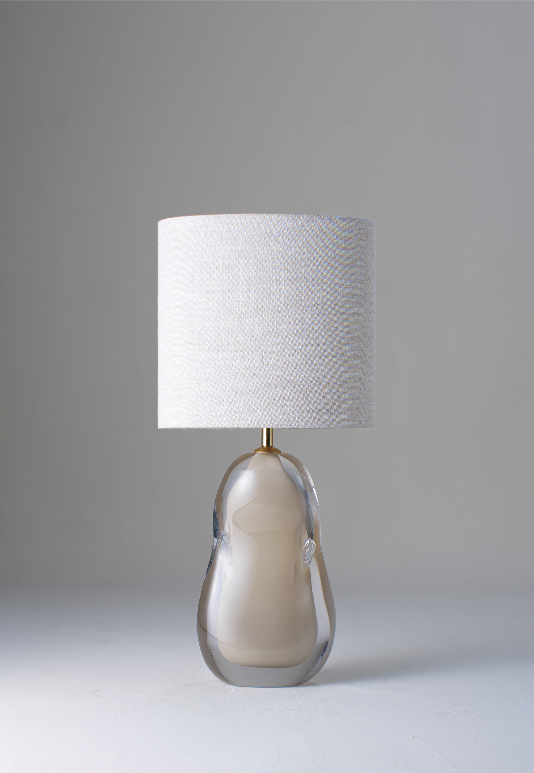 Moth shown with 10" slim straight oval Lampsahde in natural linen with cream card lining