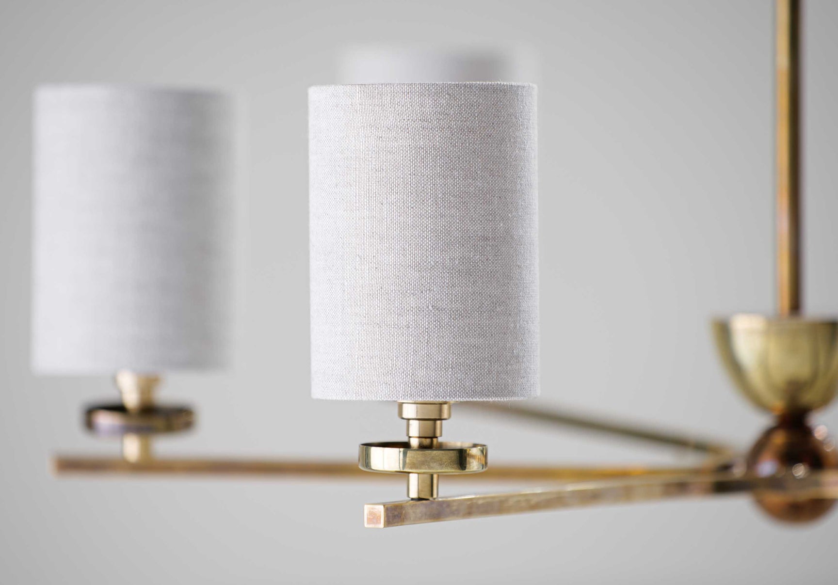 Antiqued Brass with 6 x 3.5" Top Hat lampshades in Natural Linen with Cream Card lining